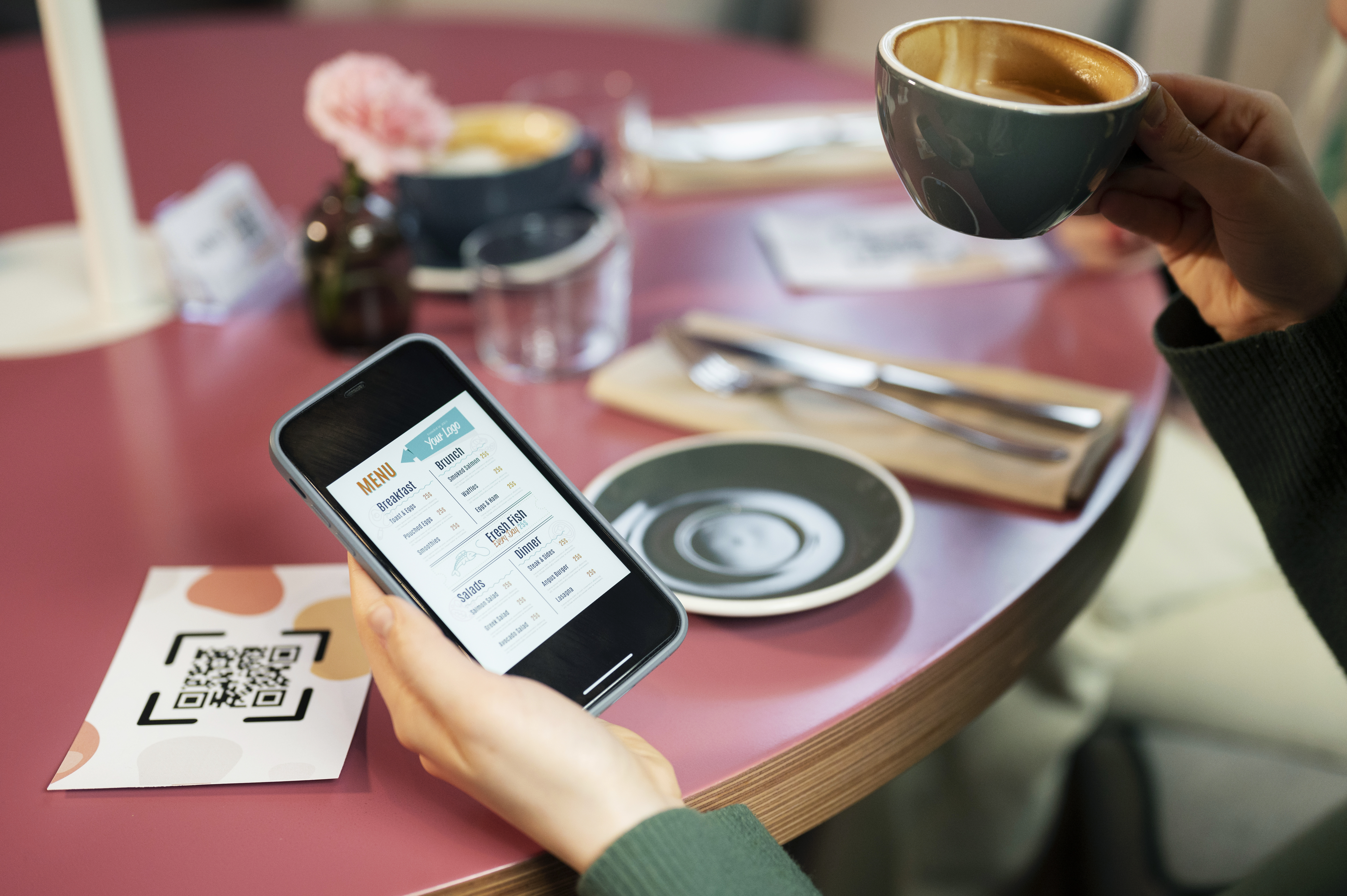 high-angle-hand-holding-smartphone-with-menu