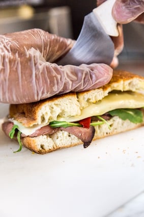 person-slicing-sandwich-bread-2160296