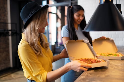 side-view-happy-friends-with-pizza